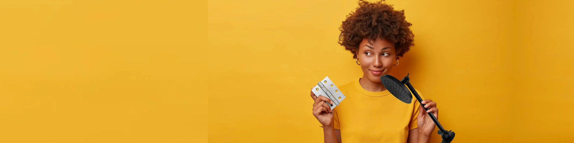 Women holding Trio door hinges 